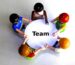 A group working together over a shared game board